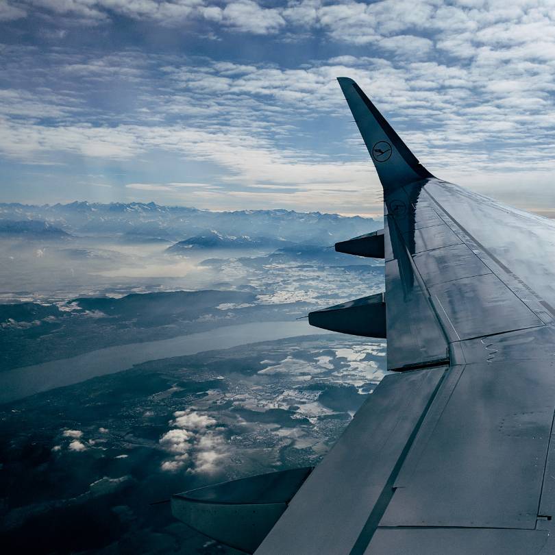 Aircraft wing above a mountain range